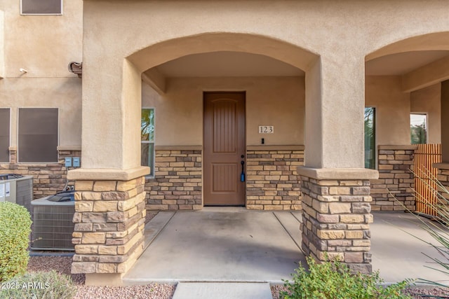 view of exterior entry with central AC