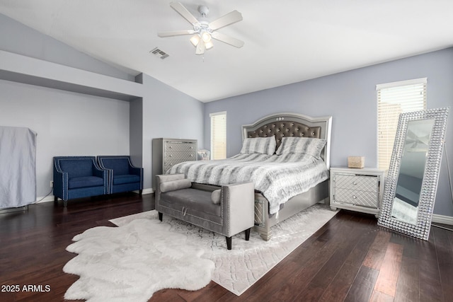 bedroom with multiple windows, dark hardwood / wood-style flooring, lofted ceiling, and ceiling fan