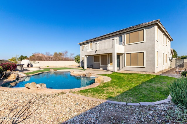 view of swimming pool with a yard and a patio area