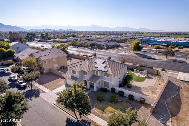 birds eye view of property with a mountain view