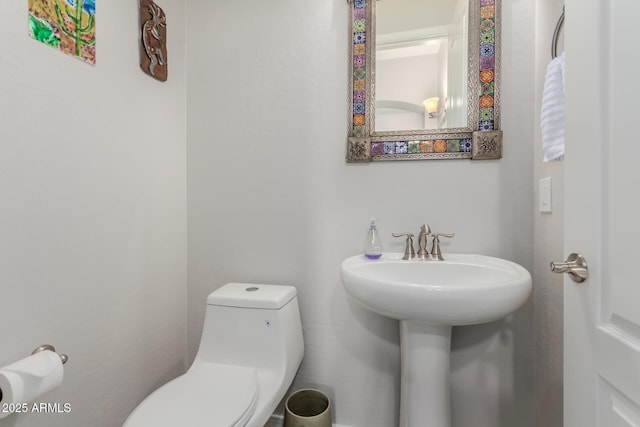 bathroom featuring toilet