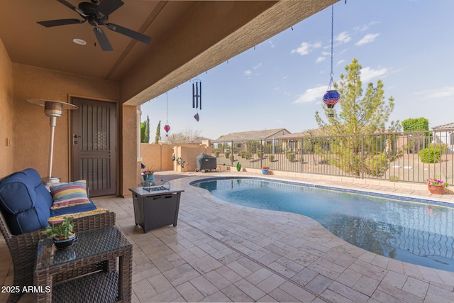 view of pool with a fenced backyard, a ceiling fan, a fenced in pool, and a patio