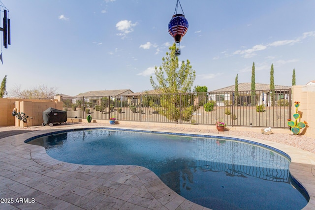 view of pool featuring a patio area, fence, and a fenced in pool