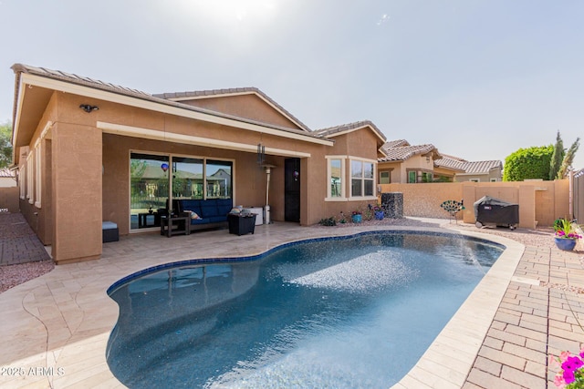 view of pool featuring a fenced in pool, area for grilling, fence private yard, a patio area, and an outdoor living space