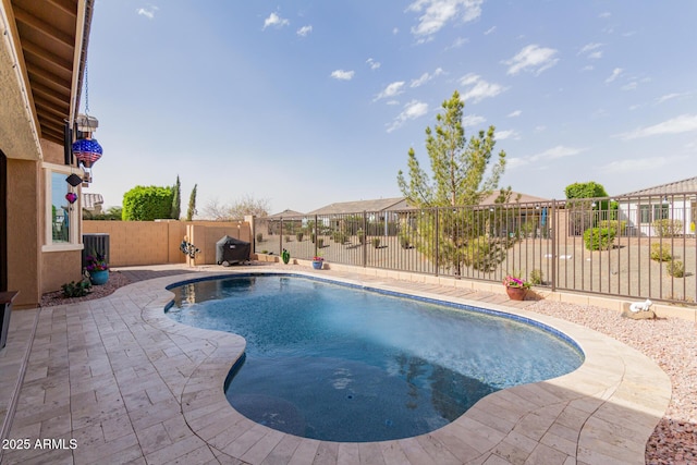 view of pool with a fenced backyard, a fenced in pool, and a patio