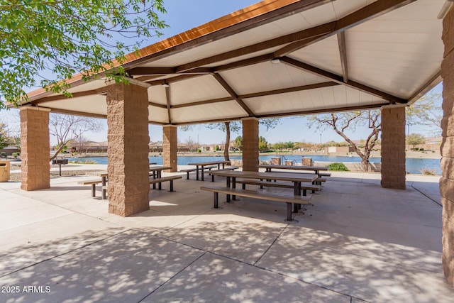 surrounding community featuring a water view, a swimming pool, and a gazebo