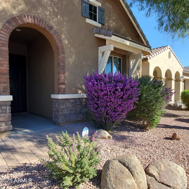 view of property exterior with stucco siding