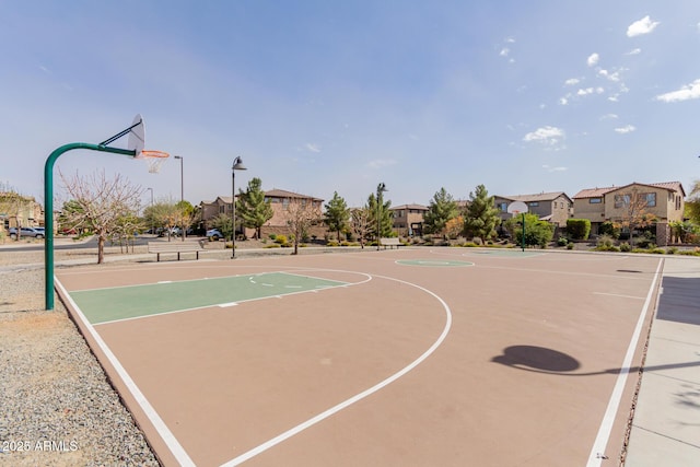 view of basketball court featuring community basketball court and a residential view