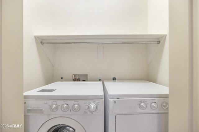 laundry area with independent washer and dryer