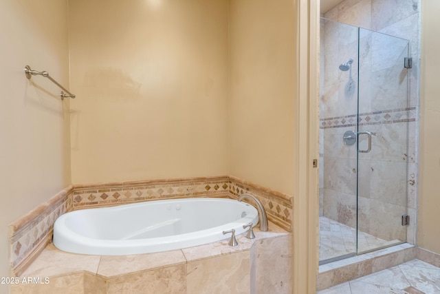 bathroom with separate shower and tub