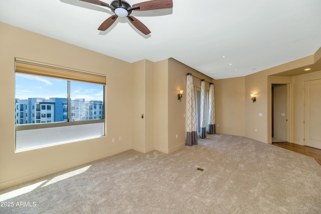 empty room featuring light colored carpet