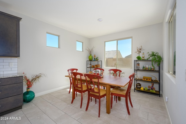 dining area featuring light tile patterned floors