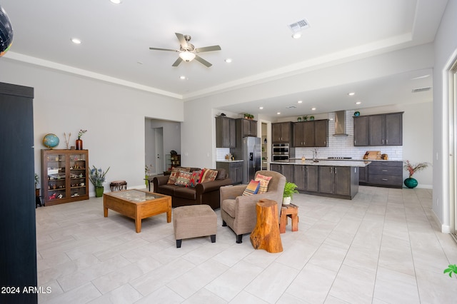 tiled living room with sink and ceiling fan