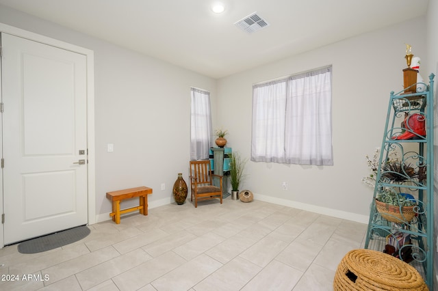 sitting room featuring light tile patterned floors