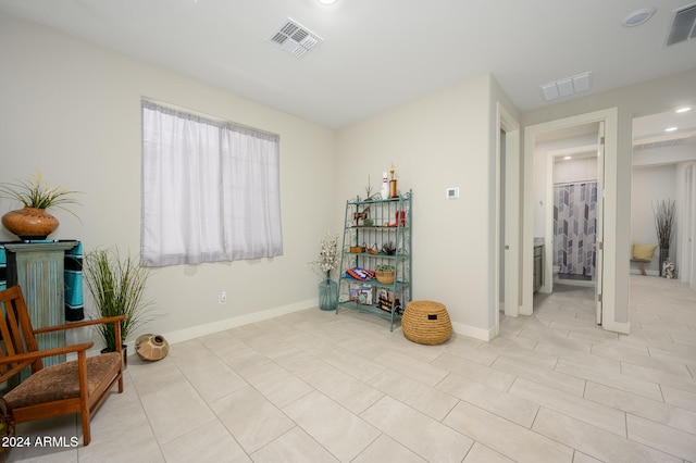 living area featuring light tile patterned floors