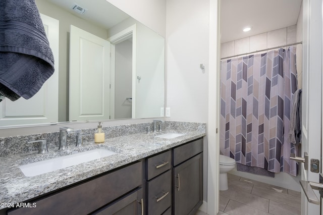 full bathroom featuring vanity, shower / tub combo with curtain, toilet, and tile patterned flooring