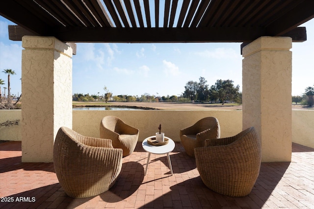 view of patio / terrace with a water view