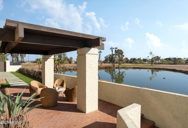 view of patio featuring a water view