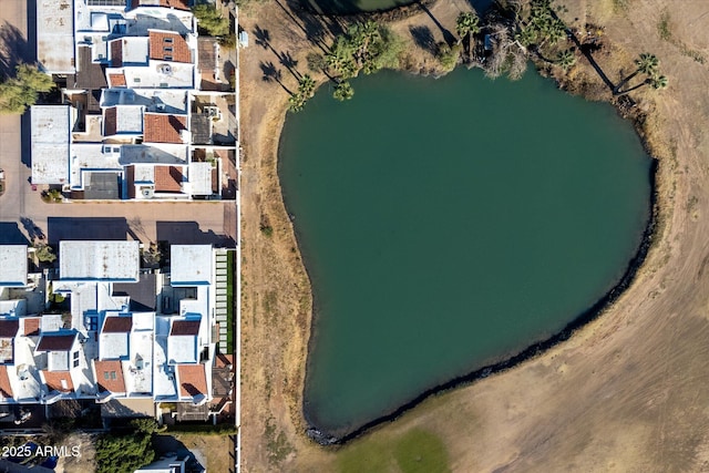 bird's eye view with a water view