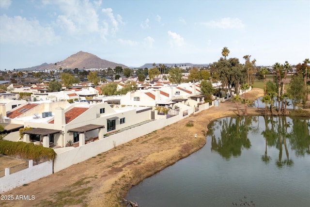 aerial view featuring a water and mountain view