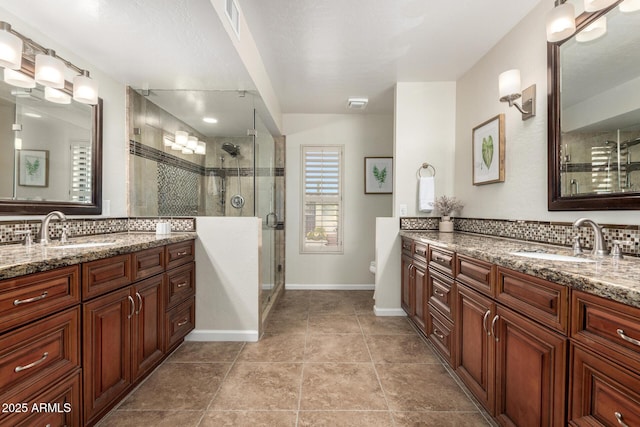 bathroom with vanity, tile patterned floors, and walk in shower