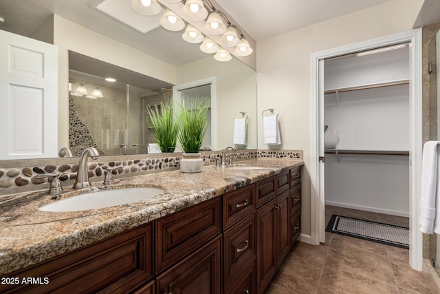 bathroom featuring vanity and an enclosed shower