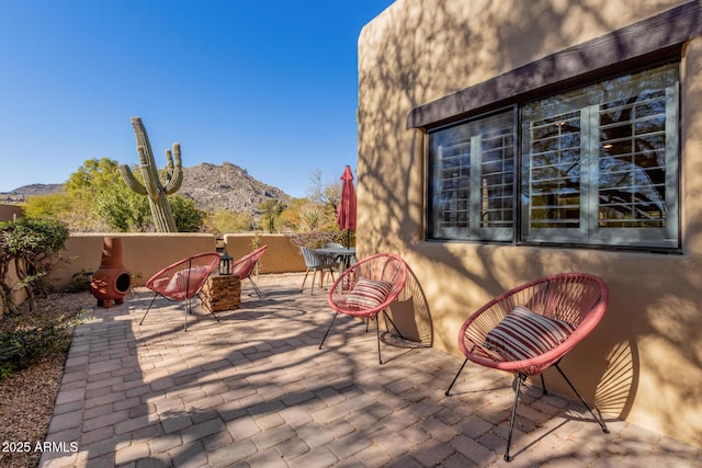 view of patio / terrace with a mountain view