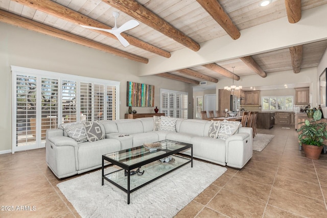 tiled living room with ceiling fan with notable chandelier, wooden ceiling, and beamed ceiling