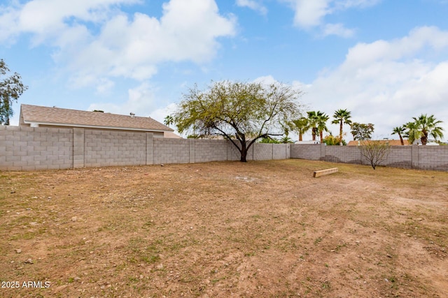 view of yard with a fenced backyard