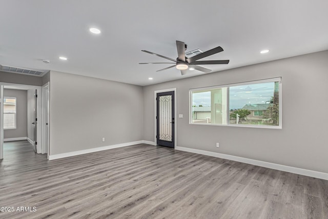 interior space featuring visible vents, recessed lighting, and wood finished floors