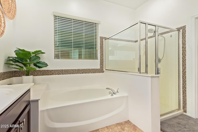 15862 W Fillmore St, Goodyear, AZ 85338 - bathroom featuring a bath, a shower stall, and vanity