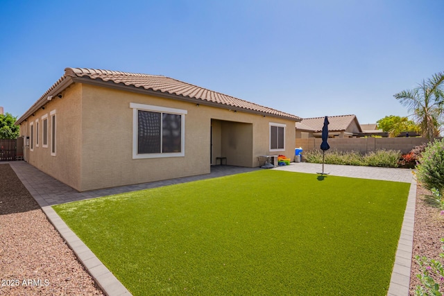 15862 W Fillmore St, Goodyear, AZ 85338 - rear view of property with stucco siding, a patio area, and a tiled roof