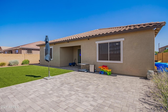 15862 W Fillmore St, Goodyear, AZ 85338 - back of house with stucco siding, a patio area, and a tiled roof
