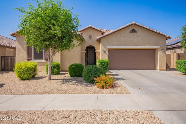 15862 W Fillmore St, Goodyear, AZ 85338 - mediterranean / spanish house featuring a garage, stucco siding, concrete driveway, and a tile roof