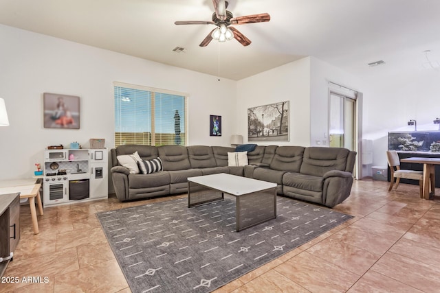 15862 W Fillmore St, Goodyear, AZ 85338 - living area featuring a ceiling fan and light tile patterned floors