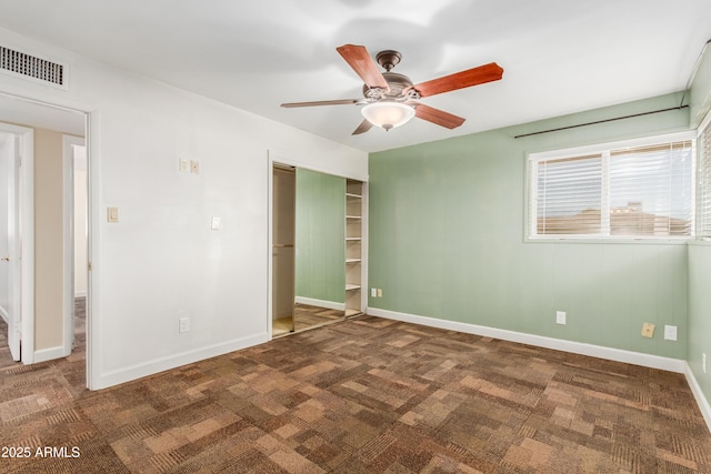 6009 W Medlock Dr, Glendale, AZ 85301 - unfurnished bedroom featuring carpet flooring, a closet, and a ceiling fan