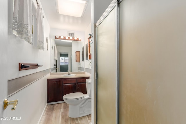 6009 W Medlock Dr, Glendale, AZ 85301 - bathroom with wood finished floors, vanity, and a shower