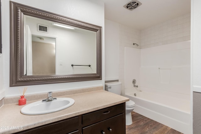 6009 W Medlock Dr, Glendale, AZ 85301 - full bathroom with vanity, washtub / shower combination, and wood finished floors