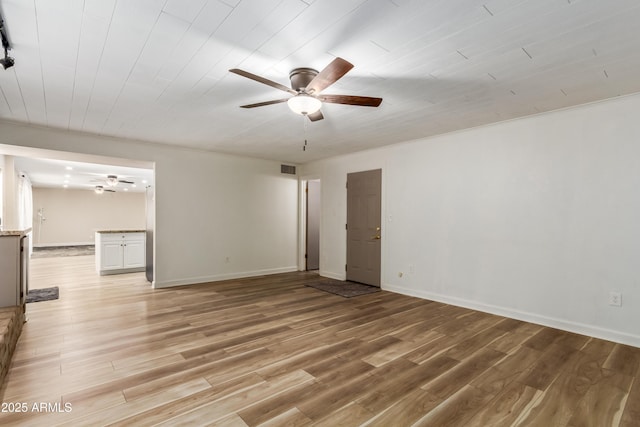 6009 W Medlock Dr, Glendale, AZ 85301 - spare room featuring ceiling fan and light wood-style flooring