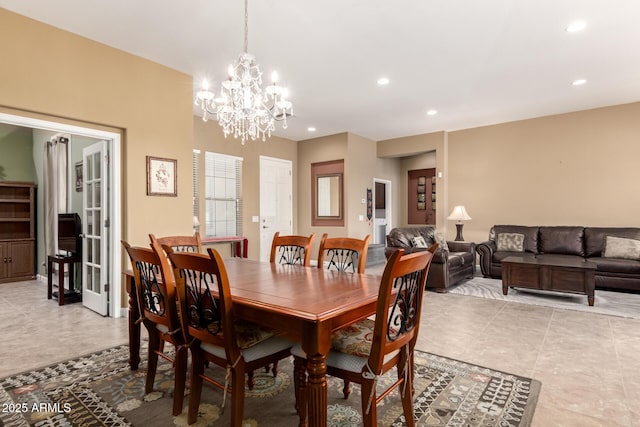 dining space featuring a chandelier and recessed lighting