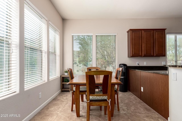 dining area featuring baseboards