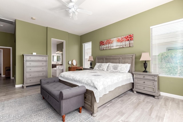 bedroom with ceiling fan, connected bathroom, light wood-style flooring, visible vents, and baseboards