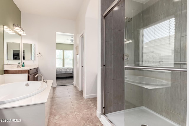 ensuite bathroom with a stall shower, ensuite bath, and vanity