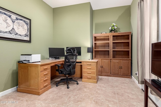 office area with baseboards and light tile patterned floors