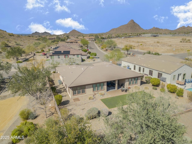 birds eye view of property with a mountain view