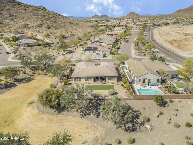 drone / aerial view featuring a residential view and a mountain view