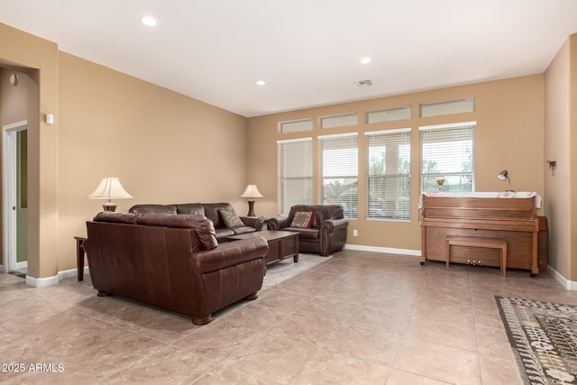 living room featuring recessed lighting, visible vents, and baseboards