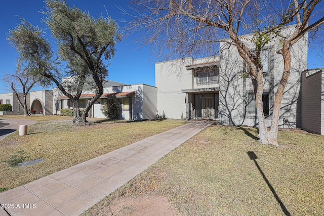 view of front of home with a front yard