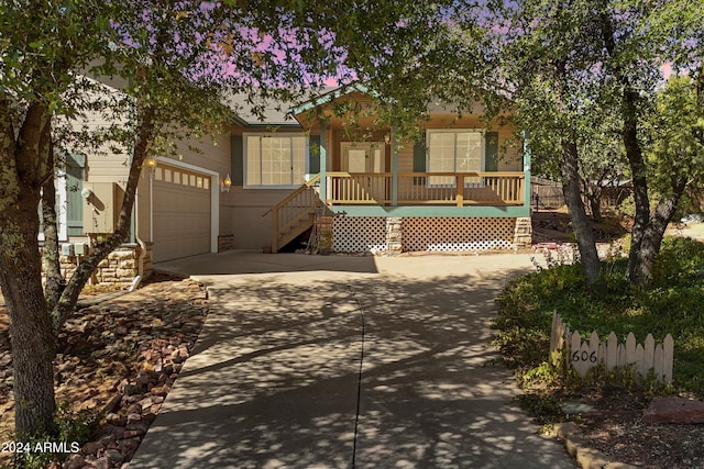 view of front facade featuring a garage and a porch