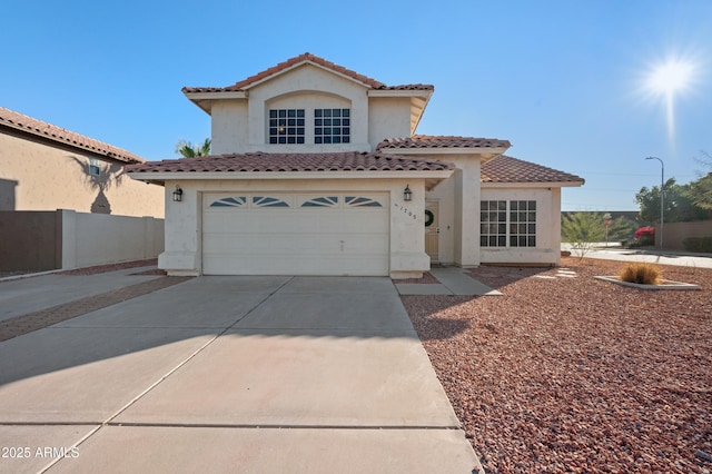 mediterranean / spanish house featuring a garage